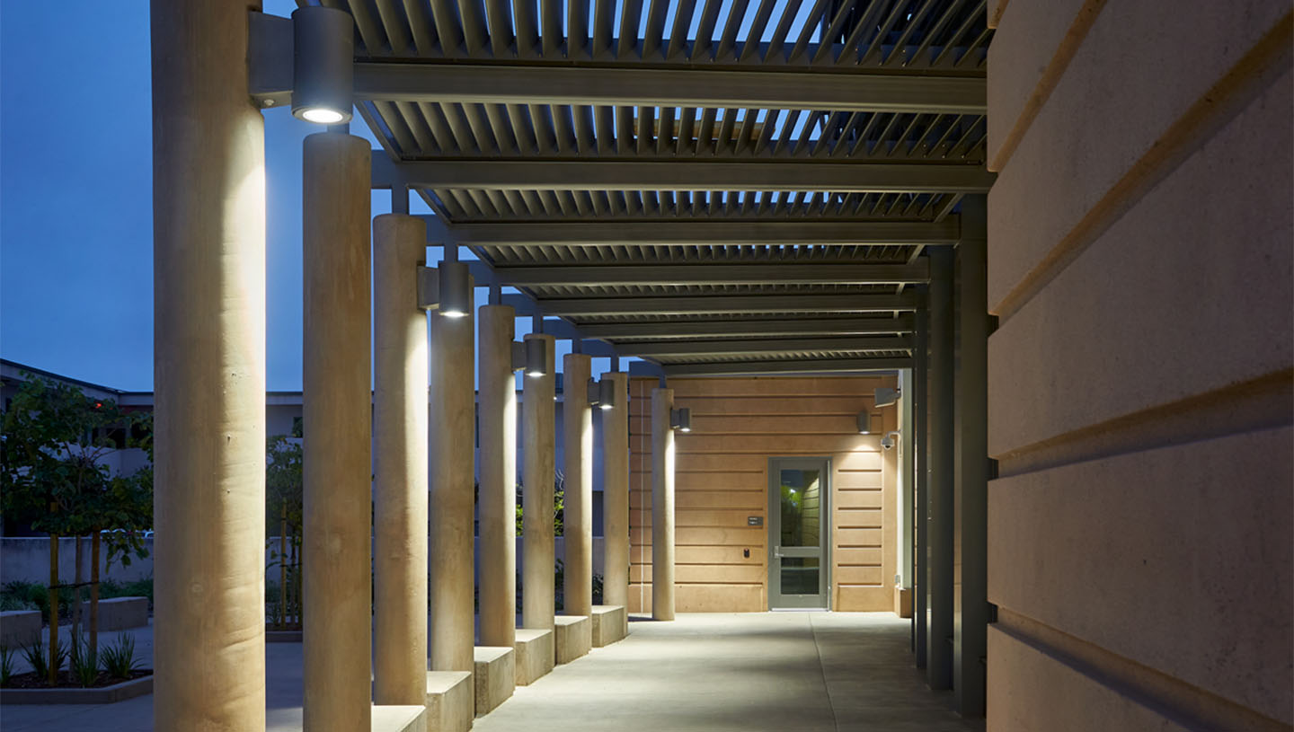 Syrios Pro cylinders light exterior of high school